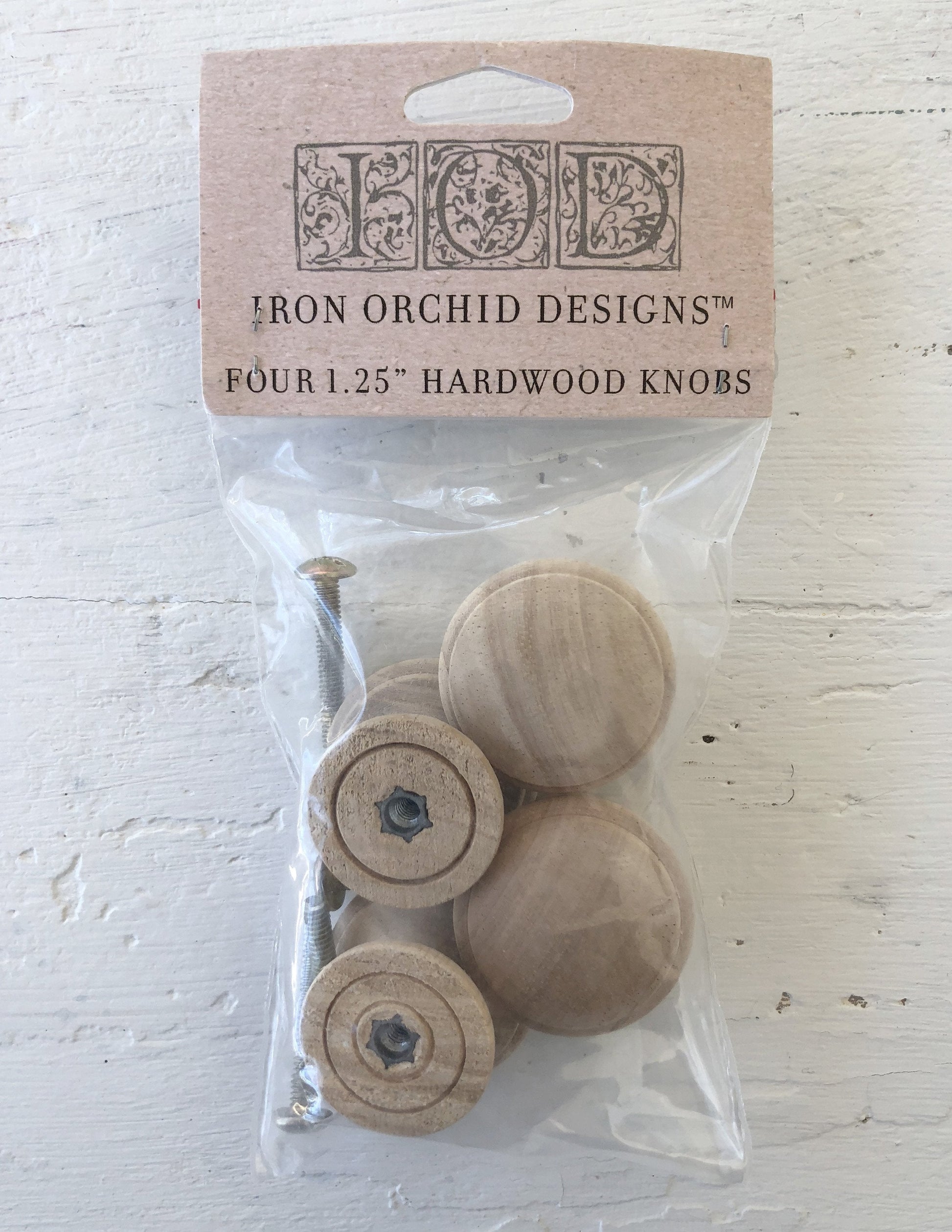 IOD Wooden Knobs 1.25 4 pack IOD hardwood knobs are a little different than the commonly available wooden knobs. Sure, they will work great for that simple pine dresser, but they work equally well on your more sophisticated pieces. Threaded insert and precision screw for easy and accurate mountingElegant profile design for wider applications than most wooden knobsHardwood and subtle grain for best use with paint, stain and all your stamping applications